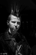 Young punk man with spiky mohawk in Queen Street, Auckland